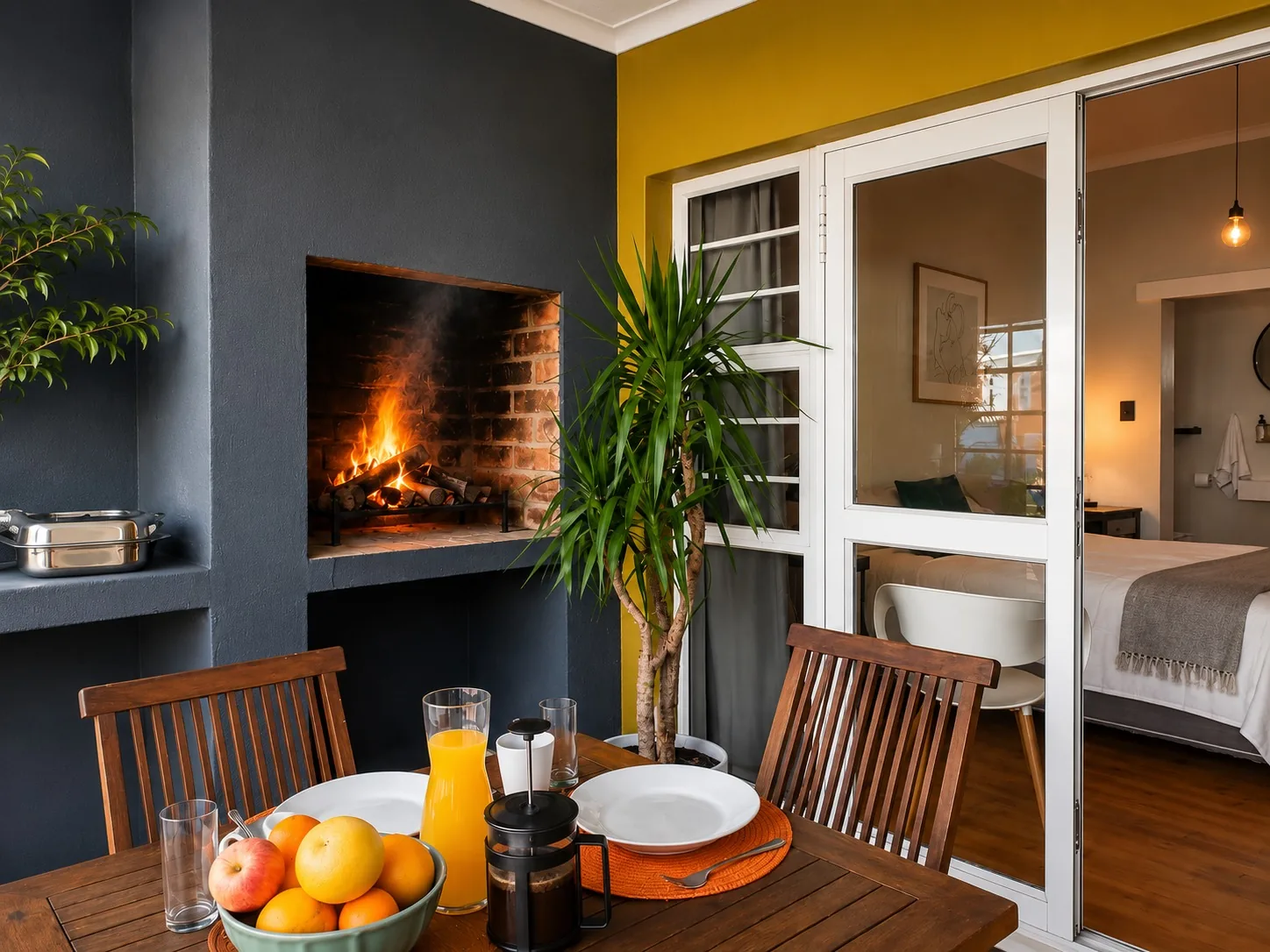 Private patio dining area at Braai & Breeze in warm sunset light